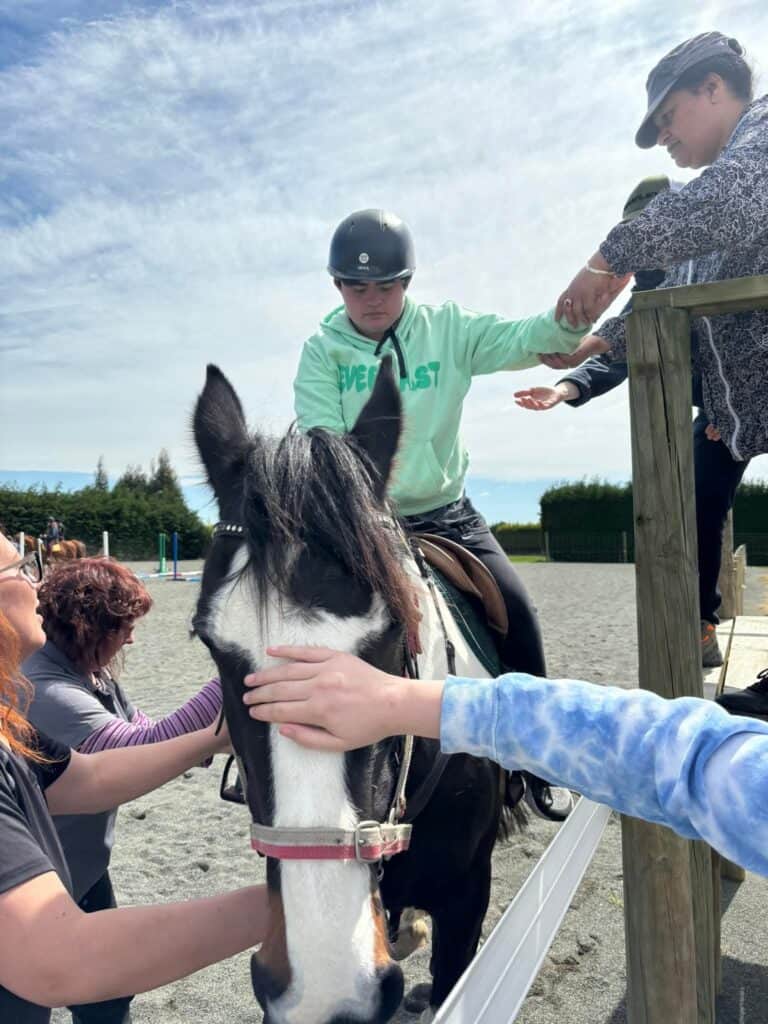 Young rider learning horse riding at Reigning Downs Hauora Centre.